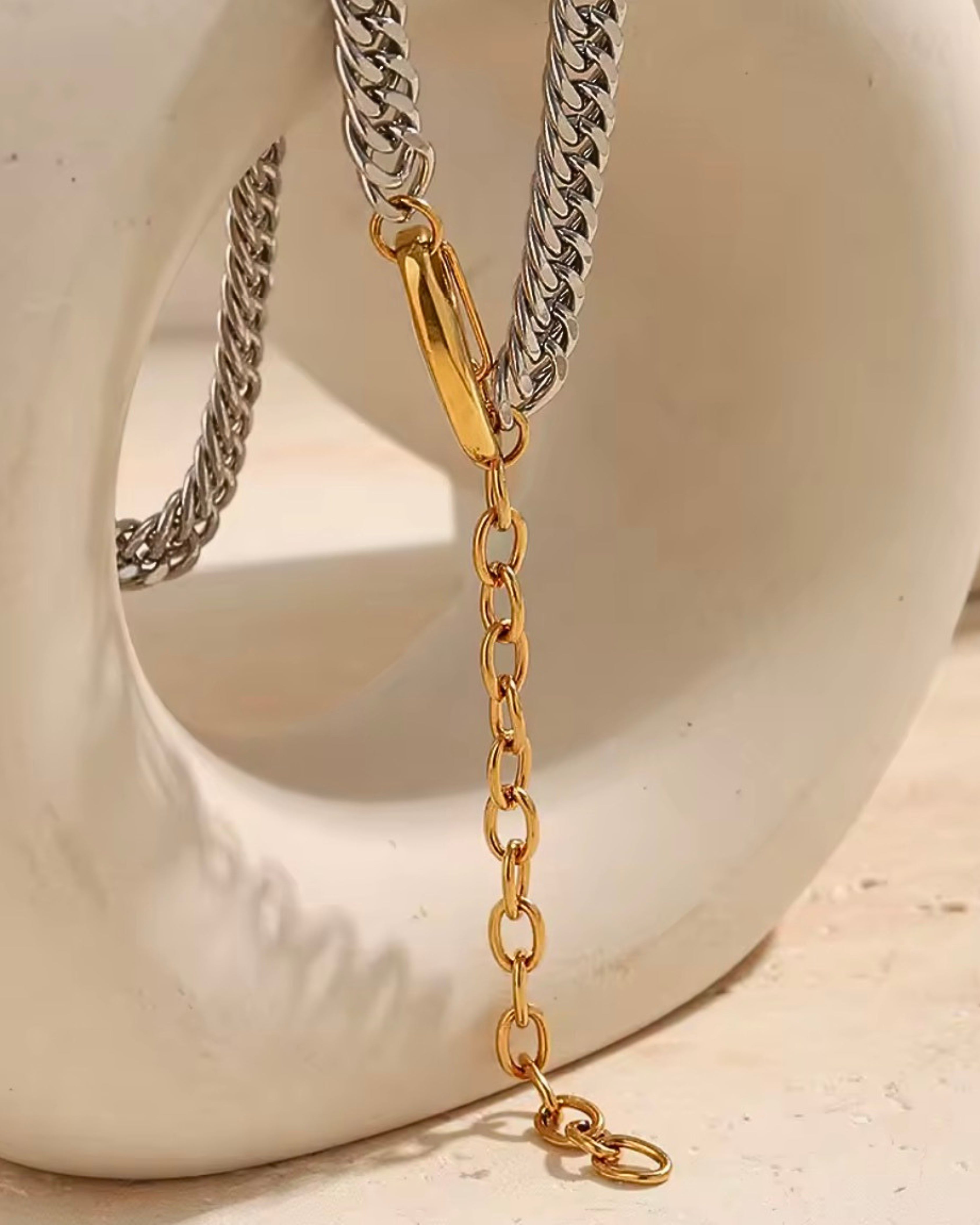 Polished silver Cuban chain necklace with contrasting gold clasp